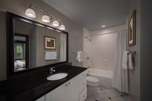 Combined shower/bathtub, hair dryer, towels, soap