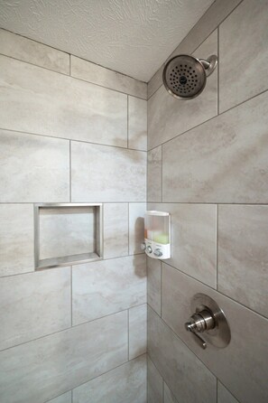 Bathtub, hair dryer, shampoo - CitySide Lofts: Unit 3 (Traverse City)