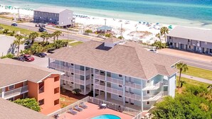 A multi-story hotel with a pool, located near a beach with clear blue waters. - ⭐Private Beach Access-Water Views-Complex Pool-Gulfview I 216- Just Beachy⭐ (Destin)