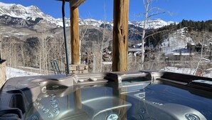 A hot tub with a clear view of snow-covered mountains in the background. - Comfortable large mountain home with stunning views, hot tub and pool table! (Telluride)