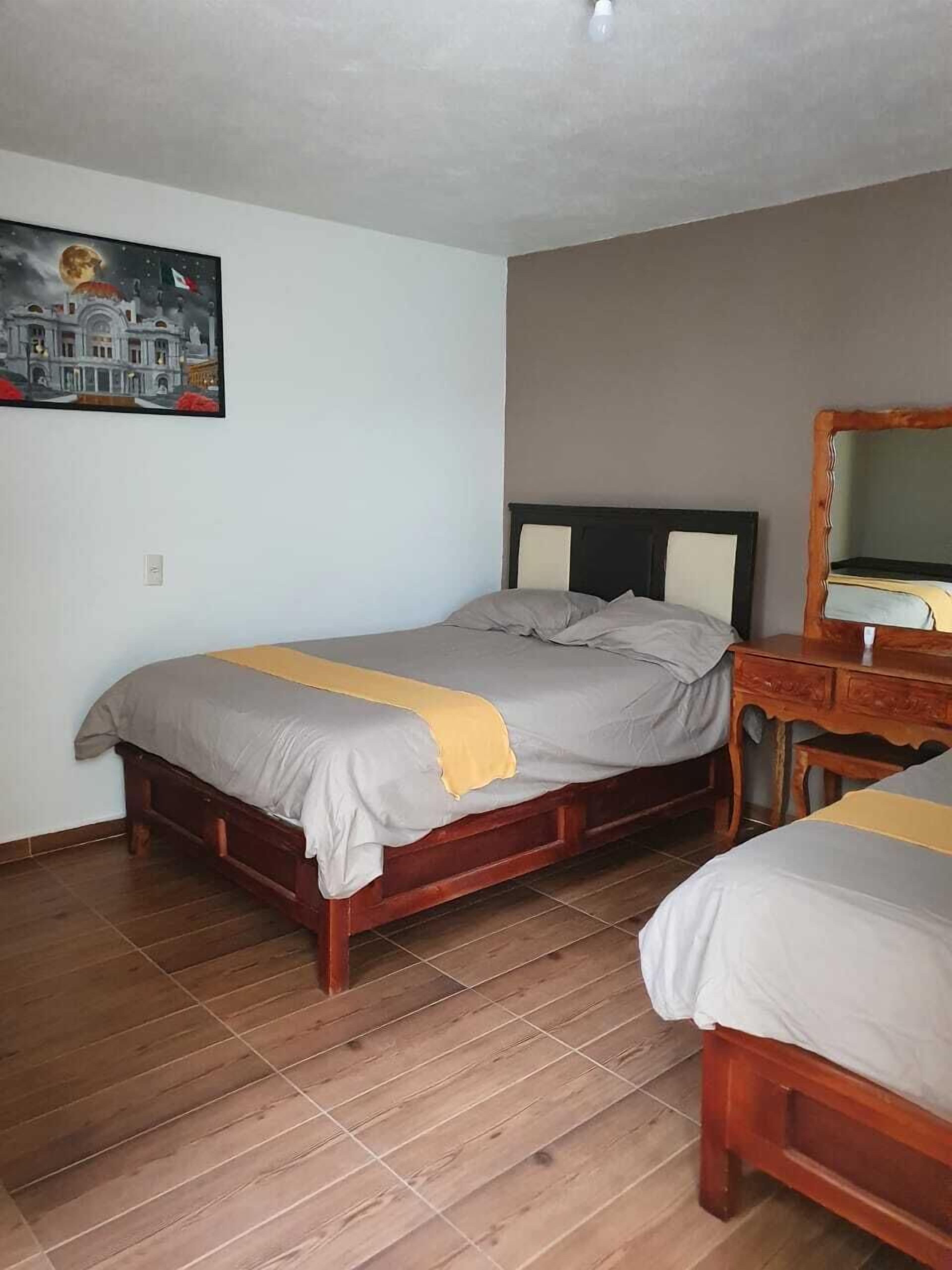 Habitación cuádruple familiar, 2 camas matrimoniales | Edredón, wifi gratis y ropa de cama 