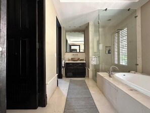 Bathtub, hair dryer, towels, soap
