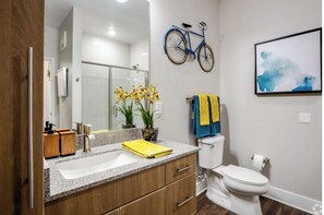 Combined shower/tub, hair dryer, towels, soap
