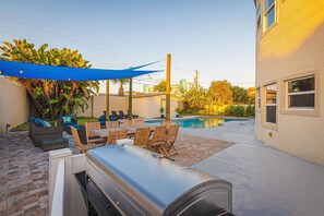 Outdoor dining - Pier Beach House! Heated Pool, Spa, Steps to Sand (Cocoa Beach)