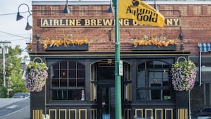 A brick building with a sign reading "Airline Brewing Co." and a yellow banner advertising "Anum Gold." - Brand new Apt B: 1 Bedroom 1 Bath in the Heart of Downtown Ellsworth (Ellsworth)