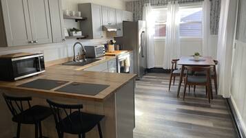 Coffee/tea maker, fridge, microwave, oven