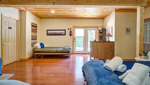 A room with a wooden ceiling, a bed, a desk, and a window. - ✶Appalachian Mt Cabin, Mt Views, 3BR 3BA, Fiber Wifi, Family, Hiking, Waterfalls (Unicoi)