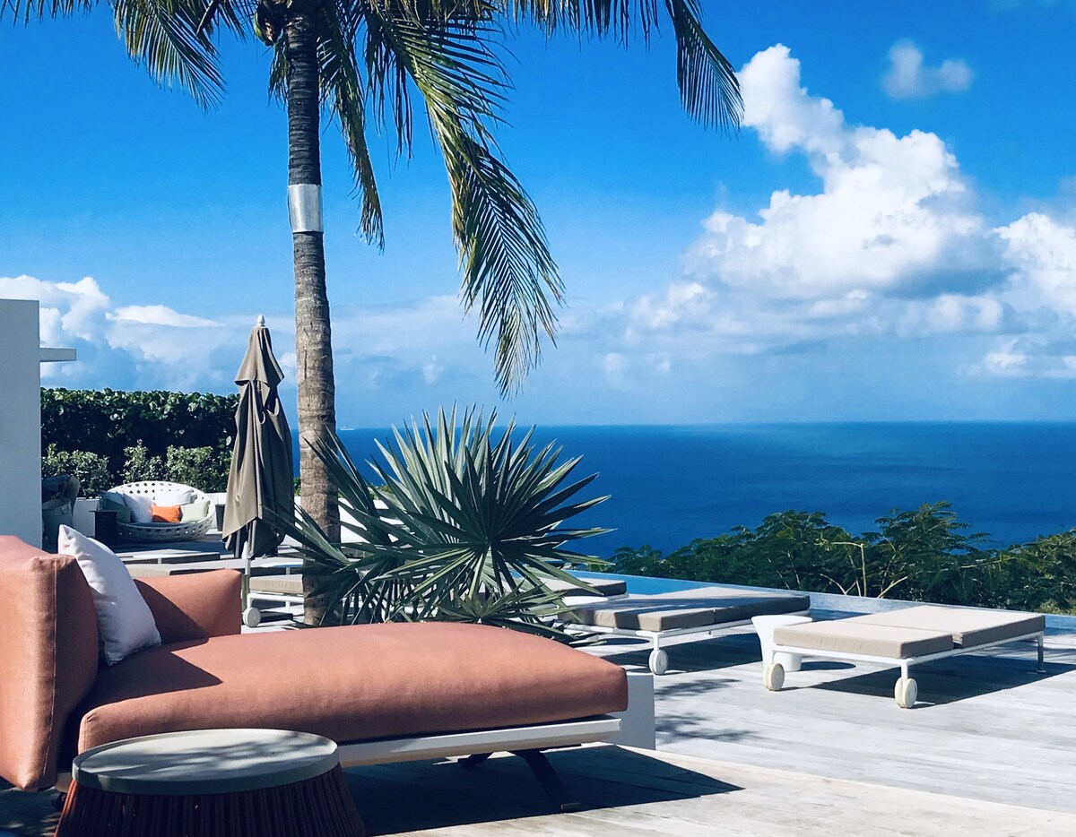 Sunset terrace with lounge seating and ocean view