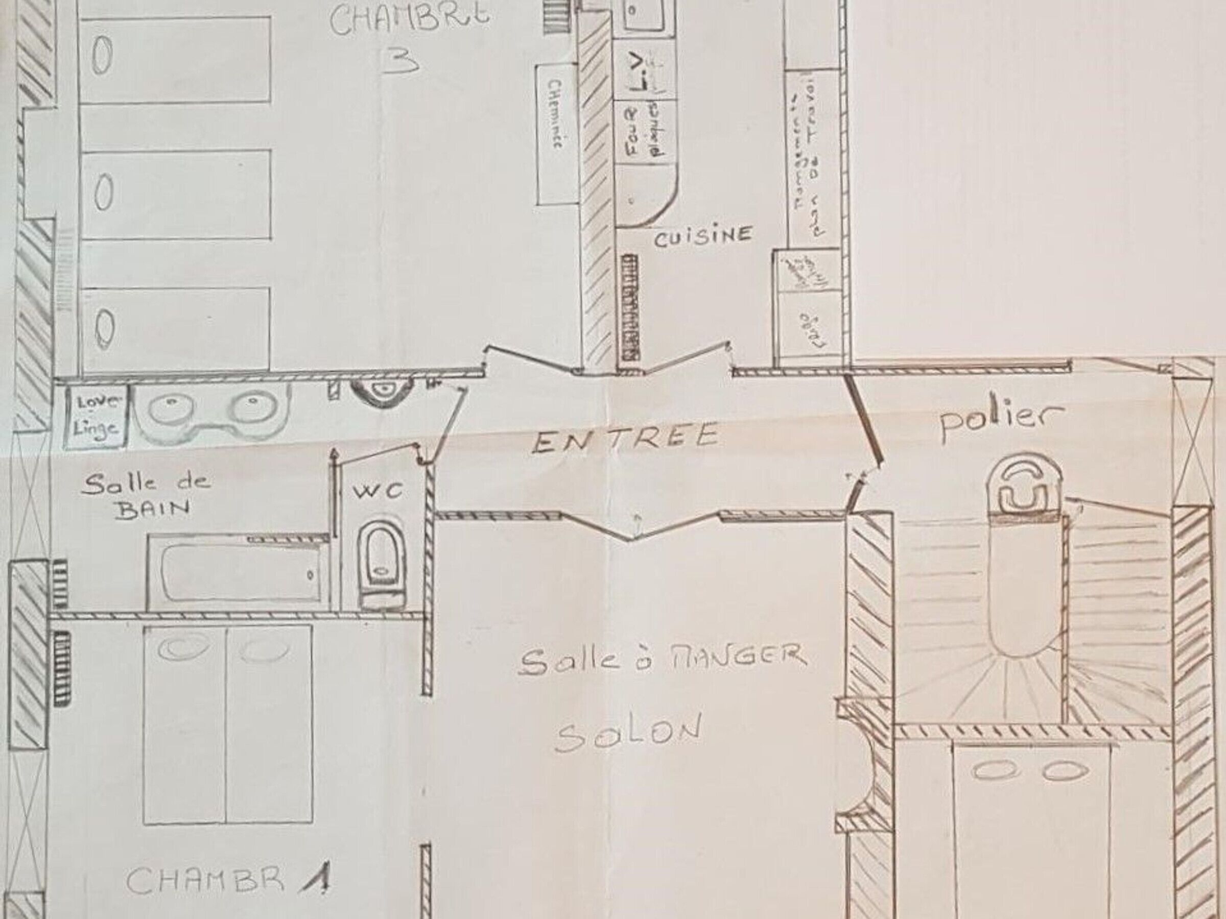 A hand-drawn floor plan of a hotel with labeled rooms including a kitchen, dining area, bathroom, and a salon.