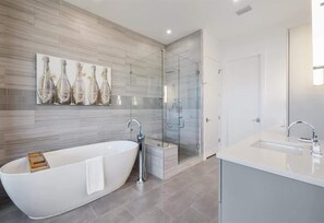 Bathtub, hair dryer, towels, soap