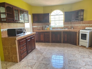 Fridge, microwave, oven, stovetop - Marshan villa 1 apartment (Montego Bay)