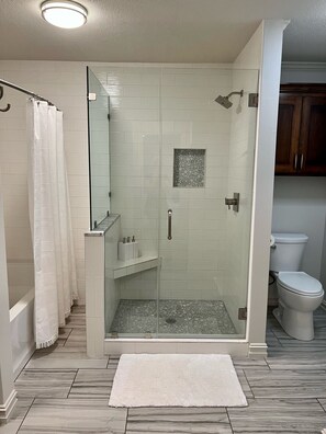 Bathtub, hair dryer, towels, soap