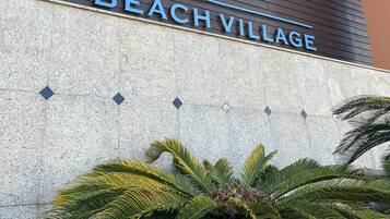 A hotel sign with the name 'Jurée Beach Village'.