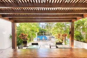 A heated pool, sun loungers