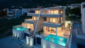 A modern multi-story house with a rooftop pool and outdoor seating areas. - Gorgeous home in Makarska with sauna (Makarska)