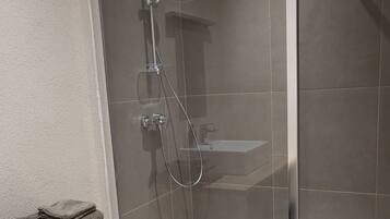 Bathtub, hair dryer, towels, soap