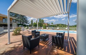 A covered outdoor area with a pool, lounge chairs, and a pergola. - Pet friendly home in Asti with private swimming pool, can be inside or outside (Asti)