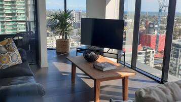 Top Floor Stunning Views | Living area | 55-inch Smart TV with cable channels, TV