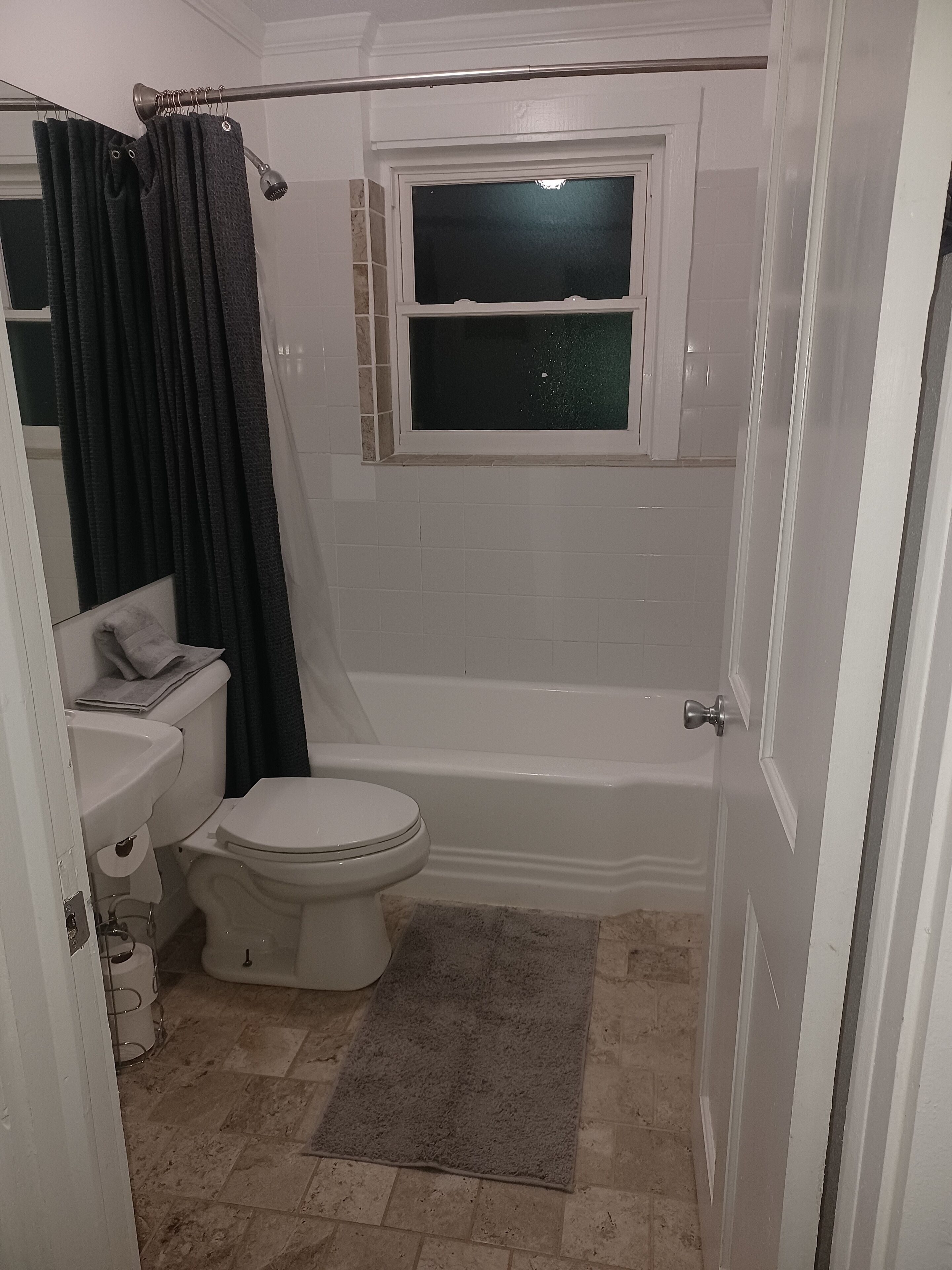 Combined shower/bathtub, hair dryer, towels, soap