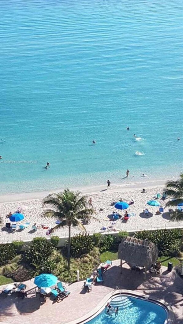 On the beach, sun loungers, beach towels