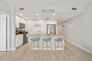 Fridge, microwave, oven, stovetop - Front Beach condo near pier with gym and great sunset views (Panama City Beach)