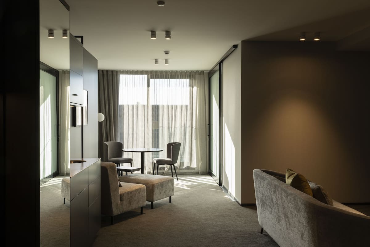 Mayfair Suite | Living area | 55-inch Smart TV with cable channels, TV, tablet
