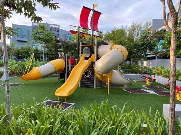 A playground with slides and a climbing structure. - The Langkawi Luxury (Langkawi)