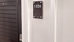 A door with a number plate labeled "1326" and a metallic handle. - Kauai Beach Resort, Top Floor, Pool View (Kauai)