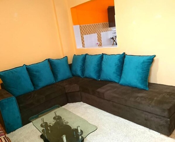 Apartamento, 1 quarto | Área de estar | TV de tela plana