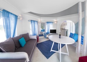 Basic Triple Room | Living area | 32-inch Smart TV with satellite channels, TV