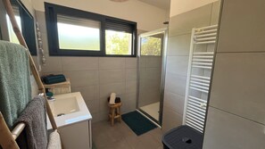 Shower, hair dryer, towels, soap