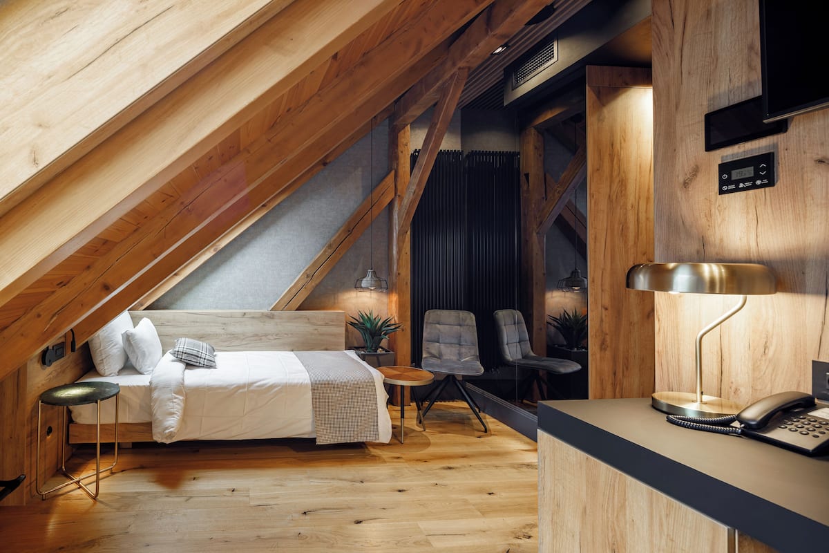 Small room - Attic | Minibar, in-room safe, desk, blackout drapes