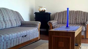 House (One bedroom Holiday home with Terrace) | Living room | 25-inch TV with satellite channels