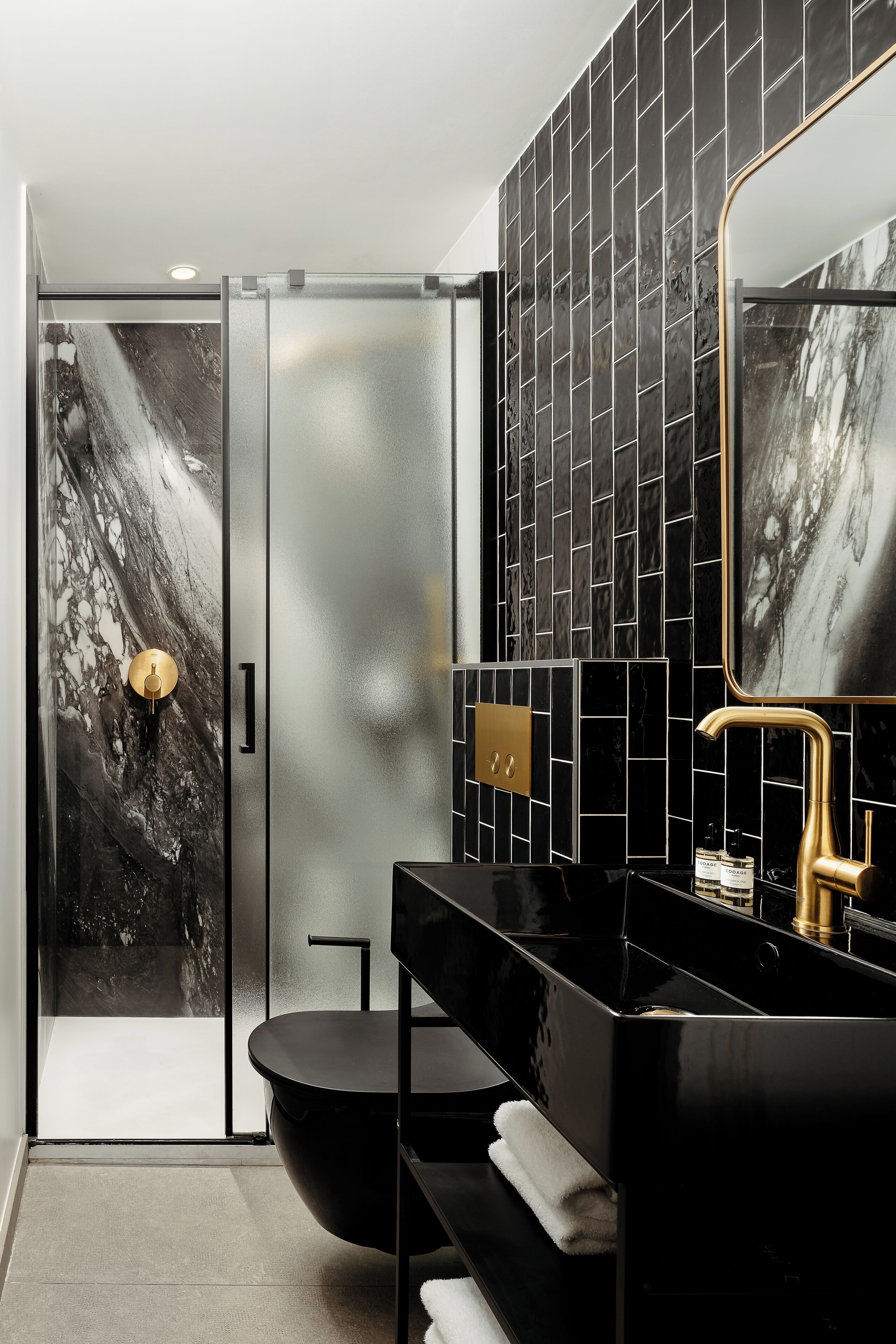 1-br atelier apartment | bathroom | shower, rainfall showerhead, designer toiletries, hair dryer