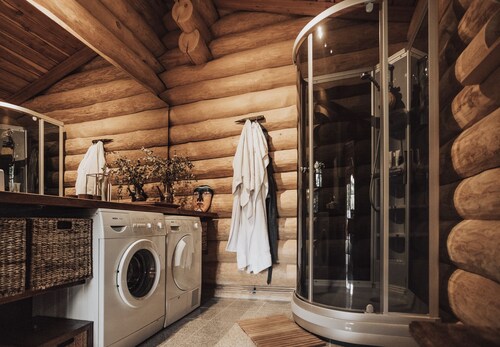 Luxurious log house near water, fjord and forest