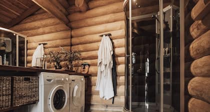 Luxurious log house near water, fjord and forest