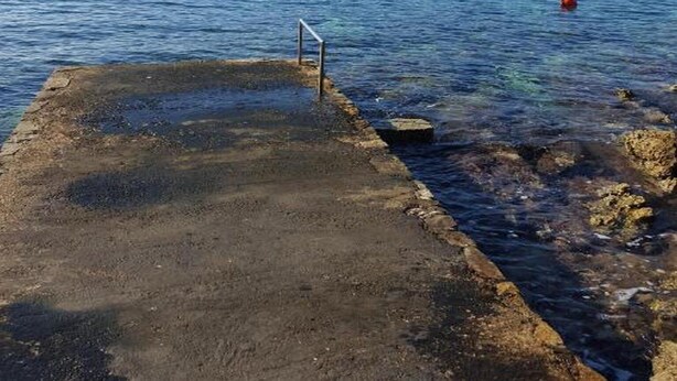 A pier extending into calm blue water with a clear sky above. - Holiday Home Angie (Solta)