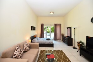 Studio | Living area | 44-inch LED TV with satellite channels, TV - MRH - Studio in Discovery Gardens (Dubai)