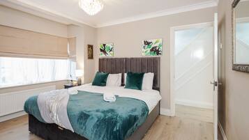 4 bedrooms, premium bedding, iron/ironing board, free WiFi