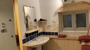 Shower, hair dryer, towels, toilet paper