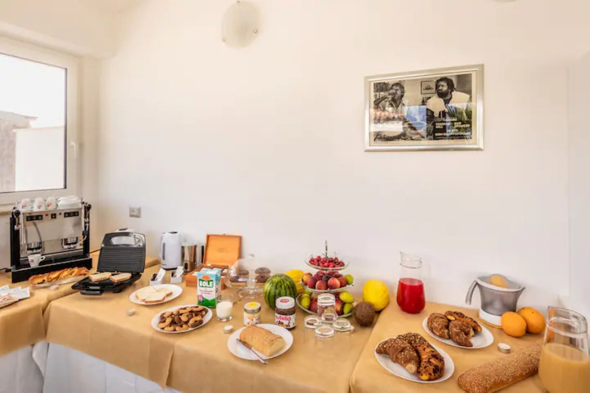 A breakfast buffet with various food items and beverages.