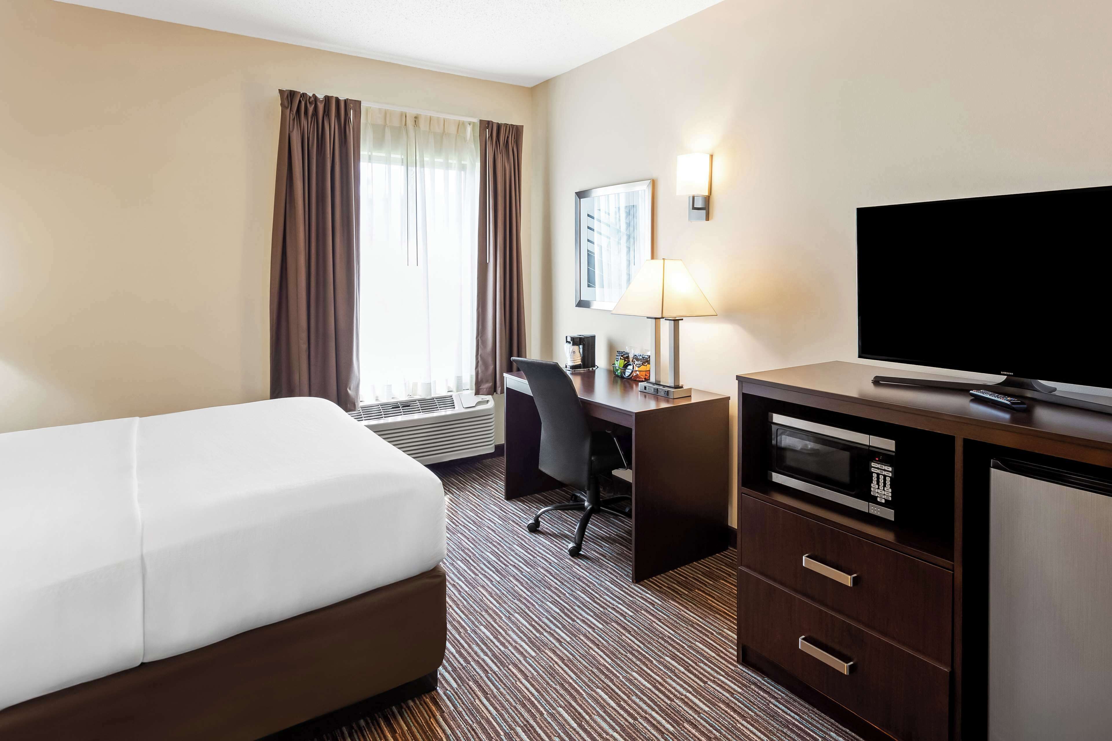 desk, laptop workspace, blackout curtains, iron/ironing board