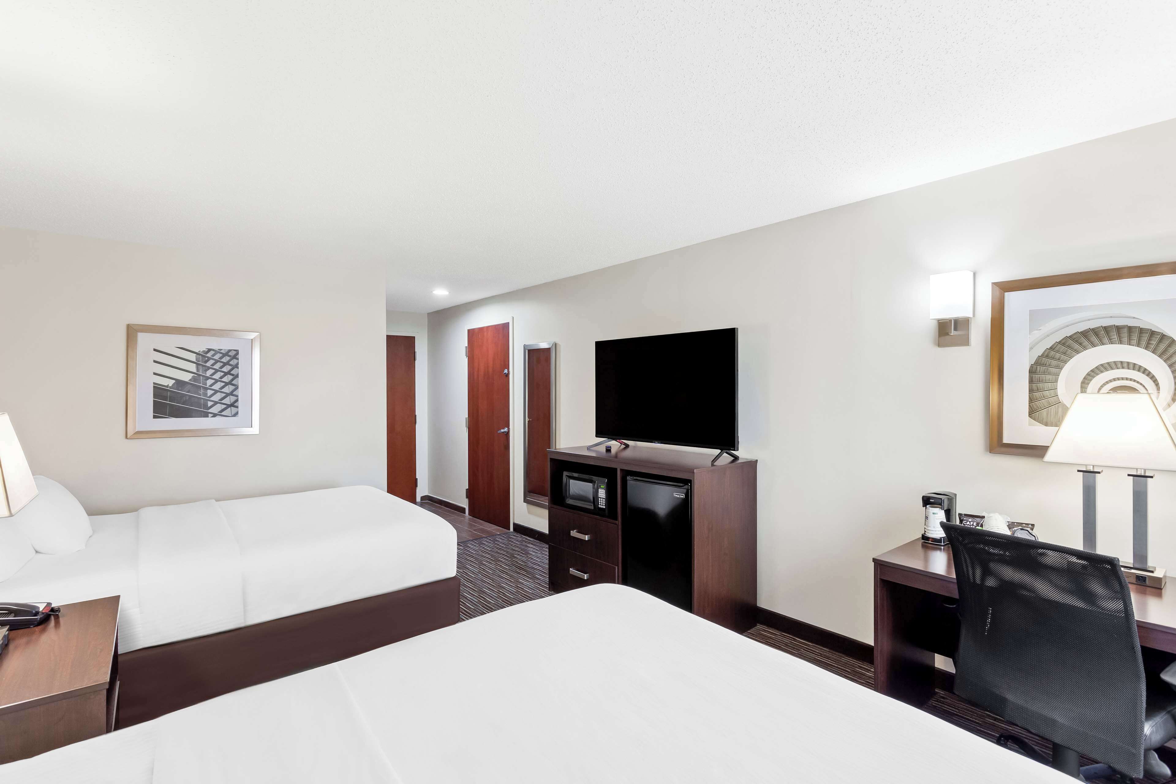 standard room, 2 queen beds, non smoking, refrigerator & microwave | desk, laptop workspace, blackout curtains, iron/ironing board