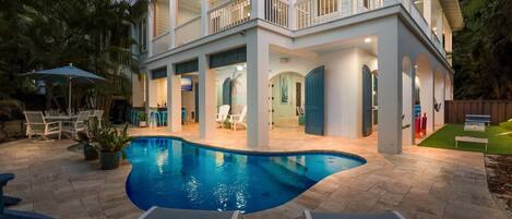 A heated pool, sun loungers