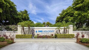 The entrance to IMG Academy in Bradenton, Florida, featuring a landscaped area with trees and shrubs. - *Casa Bella* Waterfront View! 2BR, w/2 Pools, Mins to IMG/Beach/Anna Maria Isl (Bradenton)