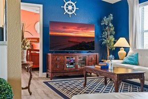 Smart TV, chimenea, reproductor de DVD y futbolito