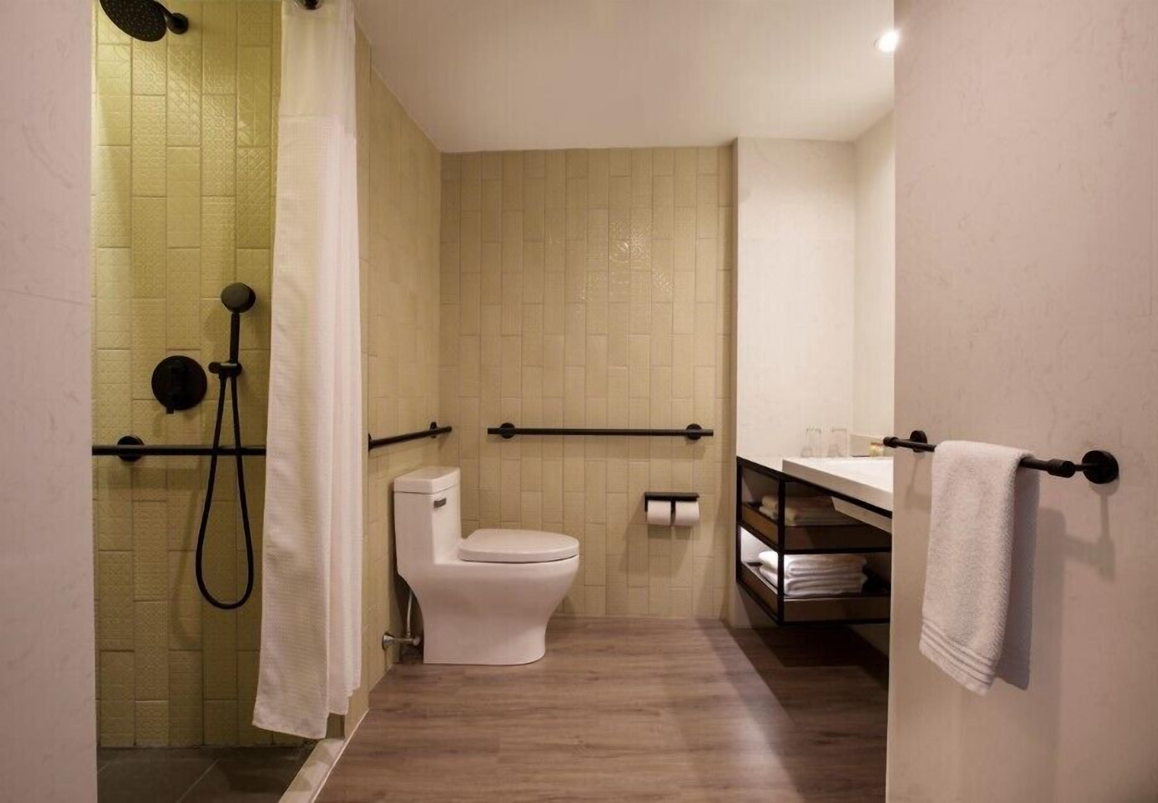 shower, designer toiletries, hair dryer, towels