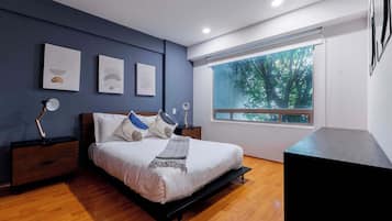 1 bedroom, desk, iron/ironing board, travel crib