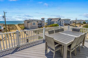 Outdoor dining - Spacious home across from the beach with partial ocean views, pool, & pool table (Virginia Beach)