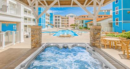 Beach condo with pool views, balcony, outdoor pool & gym